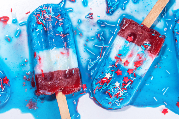 Colorful popsicles in red, white, and blue, perfect for a festive backyard BBQ.