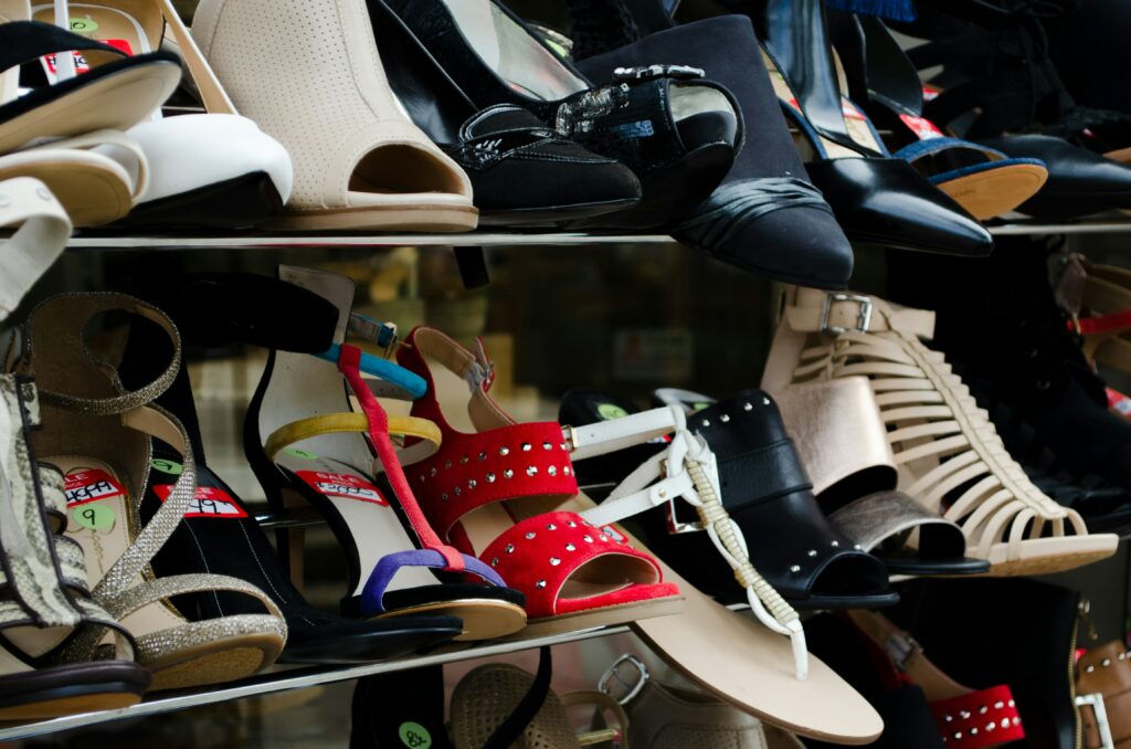 Women's shoes are on a retail rack.