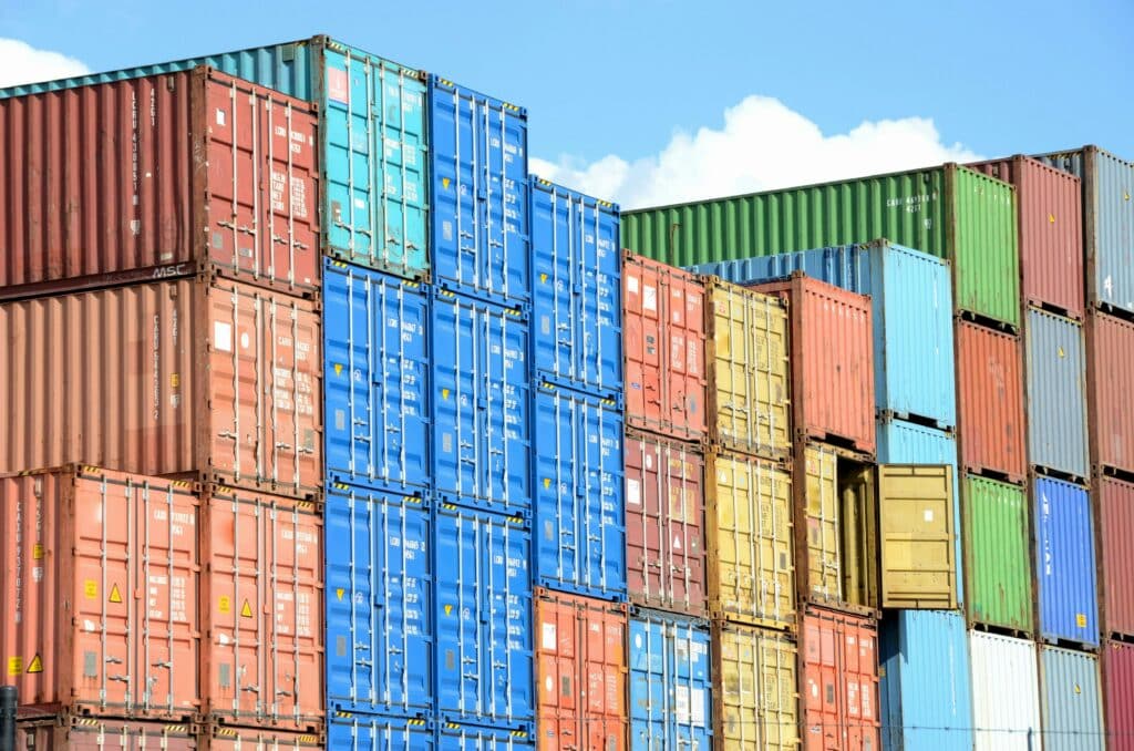 Shipping containers stacked in rows.