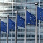 EU flags outside of a building.