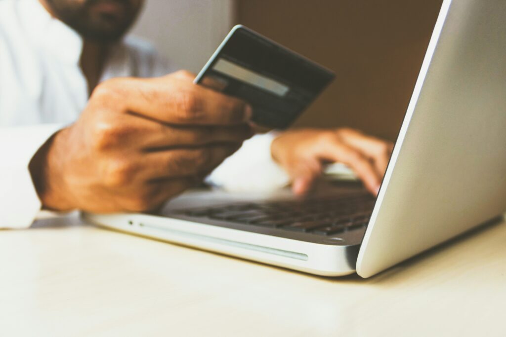 Someone is using a credit card to shop Target Canada online from their laptop.