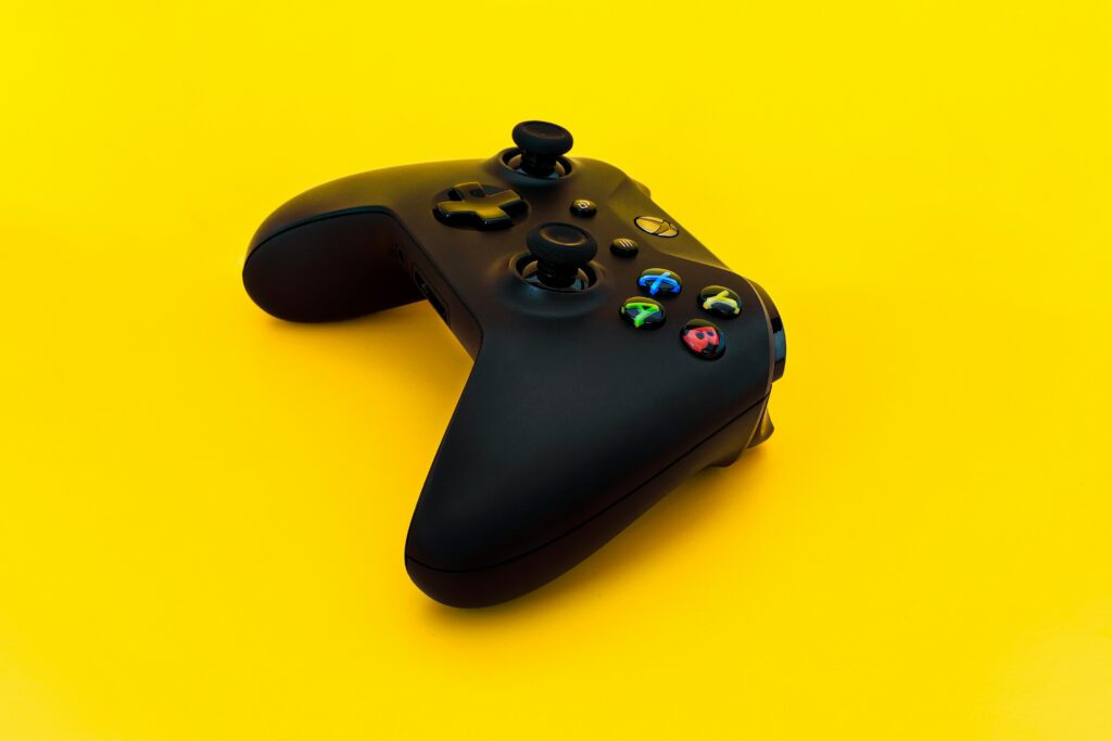 An xBox, ordered from Best Buy France, controller on a yellow background. 