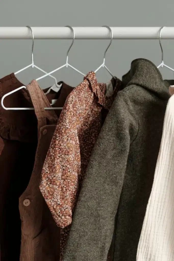 mens clothes on a rack are ready to be converted from asia size to us sizes.