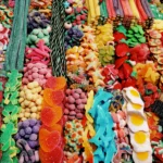 Rows of fresh gummy American candy in a candy store.