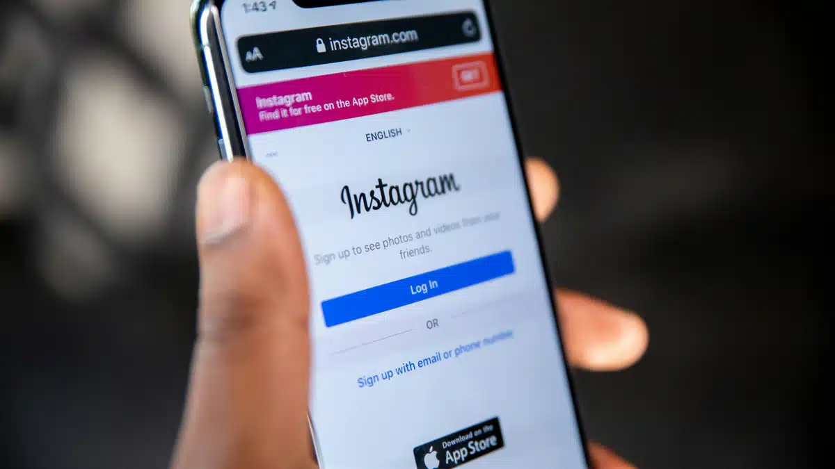 Someone holding the Instagram log in screen open on their phone. They are wondering how to sell on instagram without a website.